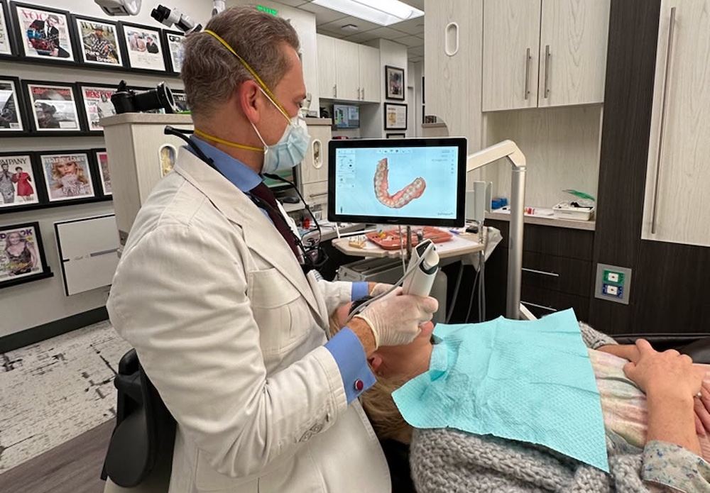 Dr. Marashi scanning a patient's teeth