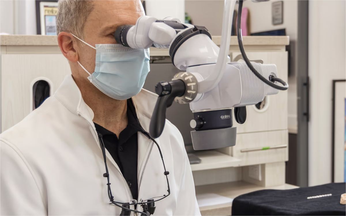 Dr. Marashi using microscope for precision dentistry